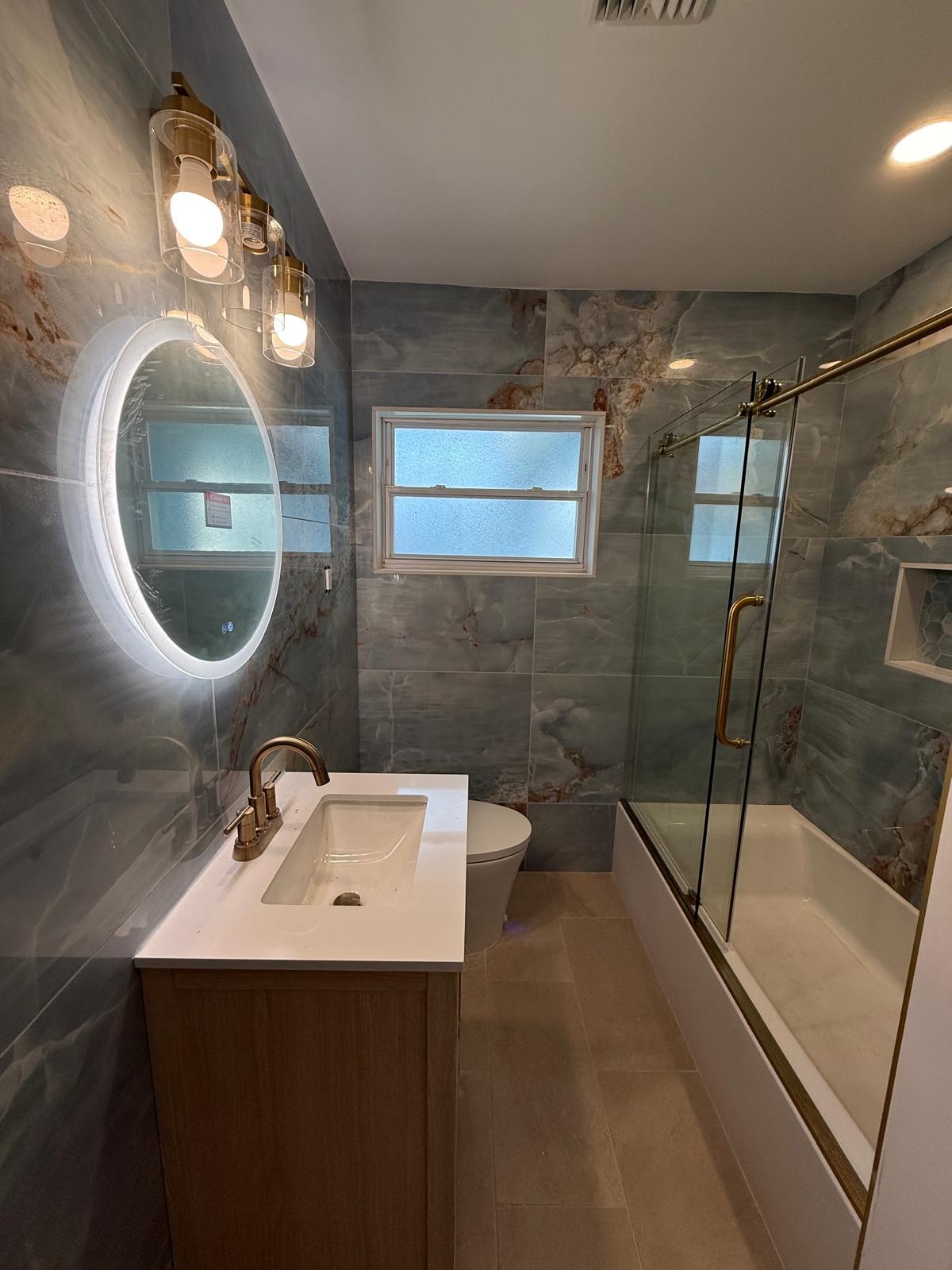 Blue onyx porcelain bathroom wet room with freestanding tub