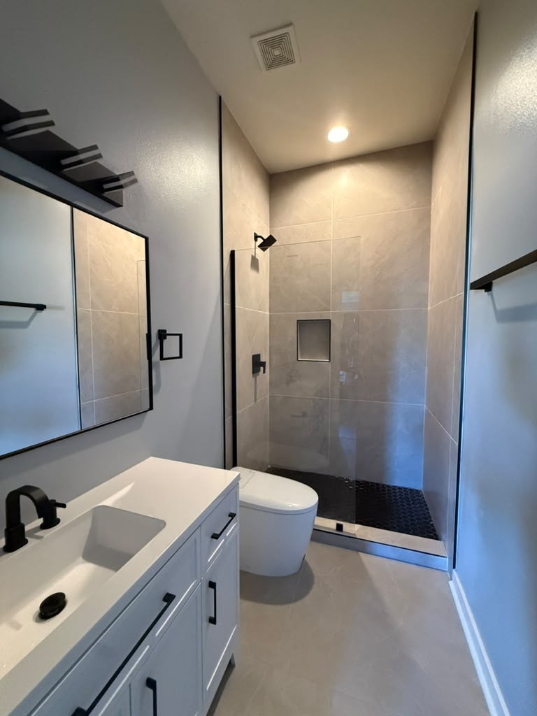 Modern Walk-In Shower with Matte Black Fixtures