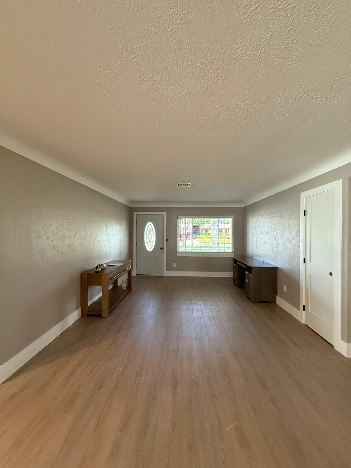 Seamless luxury vinyl plank flooring installed across Florida living room